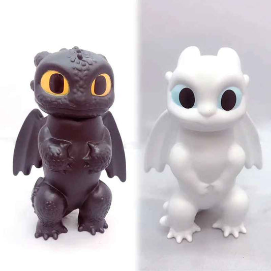 Toothless and Light Fury mini figures seated chibi Night Fury black and Light Fury white dragon statues